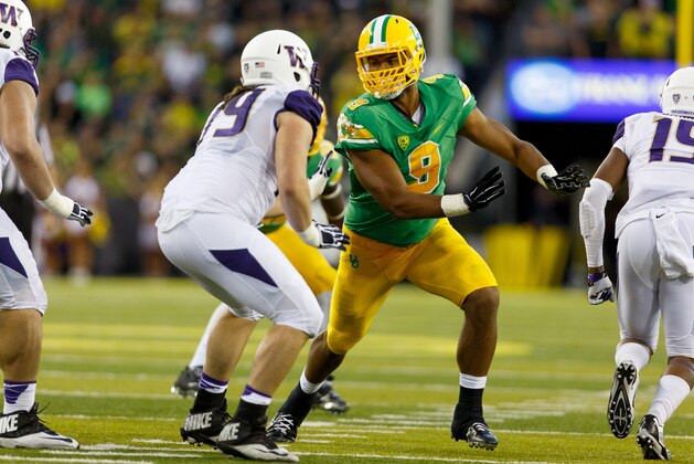 Oregon defensive lineman Arik Armstead (9) tries to get around the offensive line during the second quarter against Washington in an NCAA college football game in Eugene, Ore., Saturday, Oct. 18, 2014. (AP Photo/Ryan Kang)