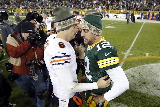 Chicago Bears quarterback Jay Cutler (6) and Green Bay Packers quarterback Aaron Rodgers (12) talk after an NFL football game Sunday, Nov. 9, 2014, in Green Bay, Wis. The Packers won 55-14. (AP Photo/Mike Roemer)