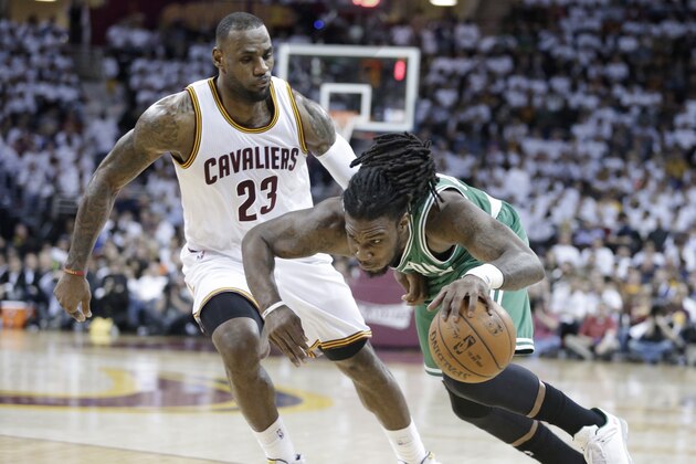 Boston Celtics’ Jae Crowder, right, drives past Cleveland Cavaliers' LeBron James (23) in the second quarter of a first-round NBA playoff basketball game Tuesday, April 21, 2015, in Cleveland. (AP Photo/Mark Duncan)