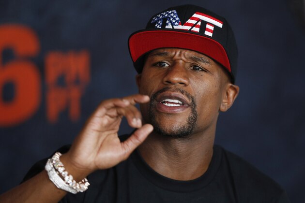 Boxer Floyd Mayweather Jr. speaks with the media before a workout Tuesday, April 14, 2015, in Las Vegas. Mayweather will face Manny Pacquiao in a welterweight boxing match in Las Vegas on May 2. (AP Photo/John Locher)