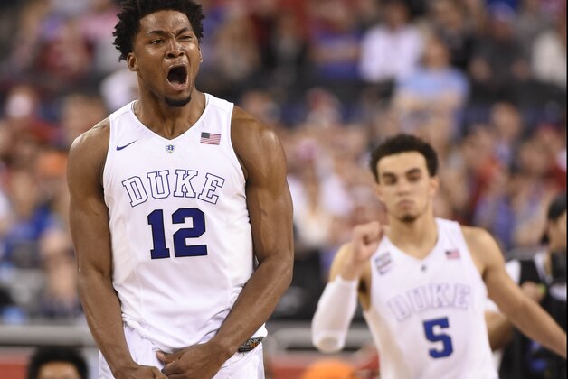Apr 6, 2015; Indianapolis, IN, USA; Duke Blue Devils forward Justise Winslow (12) celebrates after scoring against the Wisconsin Badgers during the second half in the 2015 NCAA Men's Division I Championship game at Lucas Oil Stadium. Mandatory Credit: Robert Deutsch-USA TODAY Sports