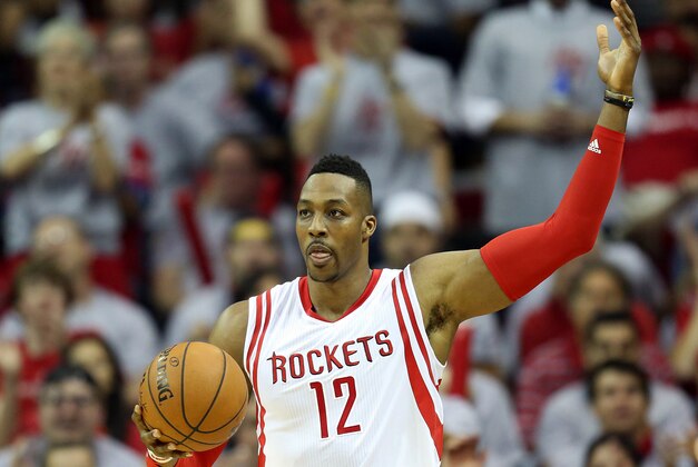 Apr 21, 2015; Houston, TX, USA; Houston Rockets center Dwight Howard (12) reacts after he blocked a Dallas Mavericks shot in the first half in game two of the first round of the NBA Playoffs at Toyota Center. Mandatory Credit: Thomas B. Shea-USA TODAY Sports
