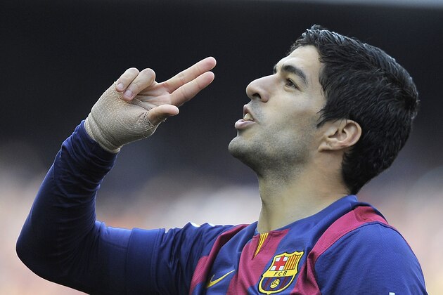 FC Barcelona's Luis Suarez reacts after scoring against Valencia during a Spanish La Liga soccer match at the Camp Nou stadium in Barcelona, Spain, Saturday, April 18, 2015. (AP Photo/Manu Fernandez)