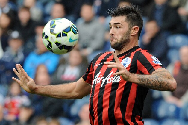 QPR's Charlie Austin controls the ball during the English Premier League soccer match between West Bromwich Albion and Queens Park Rangers at the Hawthorns, West Bromwich, England, Saturday, April 4, 2015. (AP Photo/Rui Vieira)