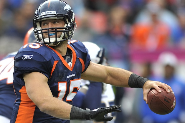 Denver Broncos quarterback Tim Tebow (15) looks to pass against the San Diego Chargers in the third quarter during an NFL football game, Sunday, Oct. 9, 2011, in Denver.  (AP Photo/Jack Dempsey)