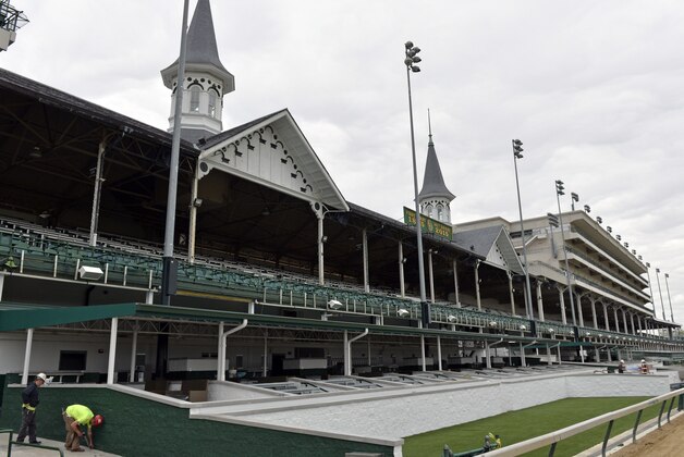 Workers put the finishing touches on the new owners' suites at Churchill Downs in Louisville, Ky., Wednesday, April 15, 2015. The new owners' boxes, along with a new trackside winners circle are part of a $4.2 capitol improvement project at the track. (AP Photo/Timothy D. Easley)