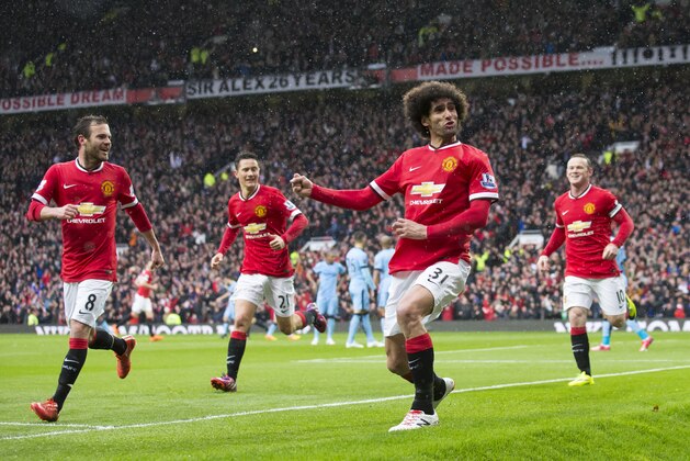 Manchester United's Marouane Fellaini, centre right, celebrates after scoring during the English Premier League soccer match between Manchester United and Manchester City at Old Trafford Stadium, Manchester, England, Sunday, April 12, 2015. (AP Photo/Jon Super) Manchester United's Marouane Fellaini, centre right, celebrates after scoring during the English Premier League soccer match between Manchester United and Manchester City at Old Trafford Stadium, Manchester, England, Sunday, April 12, 2015. (AP Photo/Jon Super)