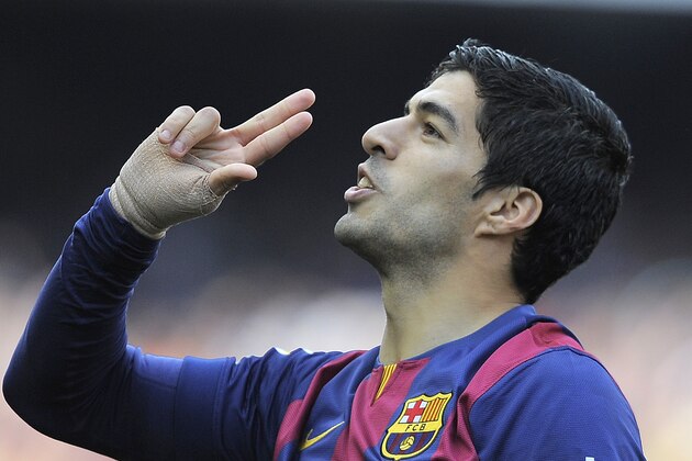 FC Barcelona's Luis Suarez reacts after scoring against Valencia during a Spanish La Liga soccer match at the Camp Nou stadium in Barcelona, Spain, Saturday, April 18, 2015. (AP Photo/Manu Fernandez)