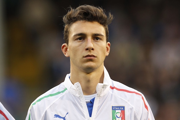 Italy's Matteo Darmian looks on during a line-up before the start of their international friendly soccer match against Republic of Ireland at Craven Cottage, London, Saturday, May 31, 2014. (AP Photo/Sang Tan)