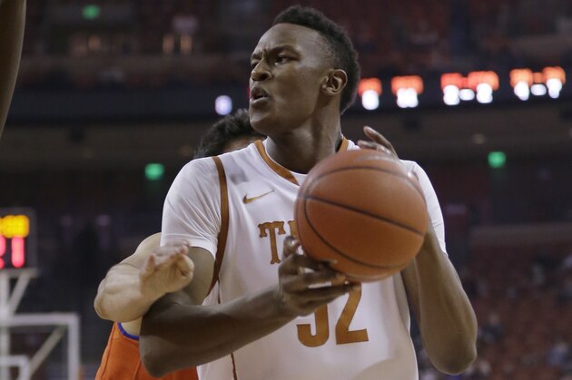 Texas’ Myles Turner (52) looks to shoot against Texas Arlington during the first half of an NCAA college basketball game, Tuesday, Dec. 2, 2014, in Austin, Texas. (AP Photo/Eric Gay)