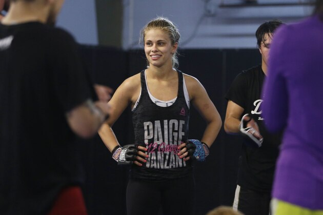 In this Monday, April 13, 2015, photo, mixed martial arts fighter Paige VanZant pauses during a break while working out for an Ultimate Fighting Championship bout, at Ultimate Fitness in Sacramento, Calif. VanZant, 21, is scheduled to fight Felice Herrig in a UFC strawweight match in New Jersey on Saturday.(AP Photo/Rich Pedroncelli)