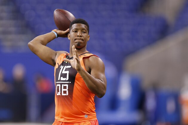 Florida State quarterback Jameis Winston runs a drill at the NFL football scouting combine in Indianapolis, Saturday, Feb. 21, 2015. (AP Photo/Julio Cortez)