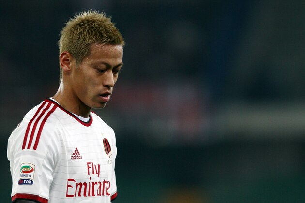 AC Milan's Keisuke Honda leaves the pitch at the end of a Serie A soccer match against Chievo at Bentegodi stadium in Verona, Italy, Saturday, Feb. 28, 2015. The match ended in a 0-0 tie. (AP Photo/Felice Calabro')