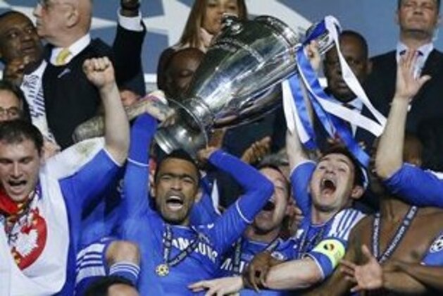 Chelsea's players celebrate with the trophy at the end of the Champions League final soccer match between Bayern Munich and Chelsea in Munich, Germany Saturday May 19, 2012. Drogba scored the decisive penalty in the shootout as Chelsea beat Bayern Munich to win the Champions League final after a dramatic 1-1 draw on Saturday (AP Photo/Matt Dunham)