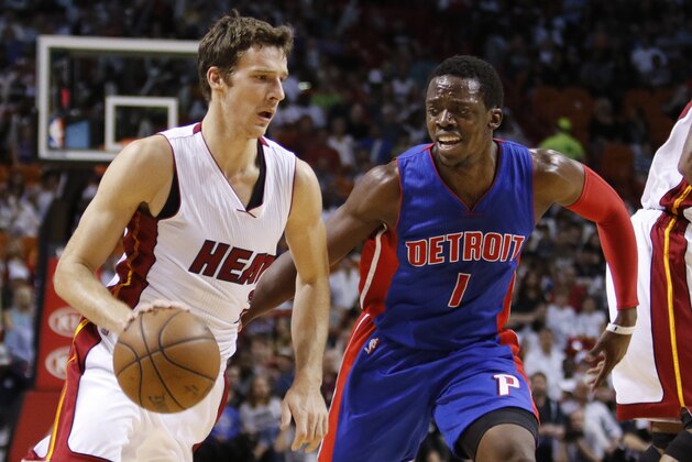 Miami Heat guard Goran Dragic (7) drives past Detroit Pistons guard Reggie Jackson in the first half of an NBA basketball game, Sunday, March 29, 2015, in Miami. The Heat won the game 109-102. (AP Photo/Joe Skipper)