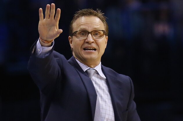 Oklahoma City Thunder head coach Scott Brooks gestures to his team in the fourth quarter of an NBA basketball game against the Boston Celtics in Oklahoma City, Wednesday, March 18, 2015. Oklahoma City won 122-118. (AP Photo/Sue Ogrocki)
