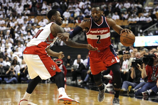 Apr 21, 2015; Toronto, Ontario, CAN; Washington Wizards guard John Wall (2) moves past Toronto Raptors forward Terence Ross (31) in the fourth quarter in game two of the first round of the NBA Playoffs at Air Canada Centre. Wizards beat raptors 117 - 106. Mandatory Credit: Peter Llewellyn-USA TODAY Sports