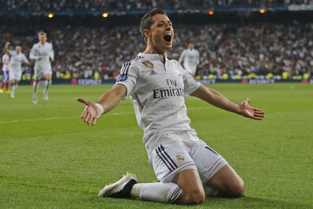 Real Madrid's Chicharito celebrates scoring his side's first goal during the second leg quarterfinal Champions League soccer match between Real Madrid and Atletico Madrid at Santiago Bernabeu stadium in Madrid, Spain, Wednesday April 22, 2015. Real won the match with a 1-0 score and advances to the semifinal. (AP Photo/Paul White)