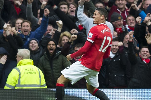 Manchester United's Chris Smalling celebrates after scoring during the English Premier League soccer match between Manchester United and Manchester City at Old Trafford Stadium, Manchester, England, Sunday, April 12, 2015. (AP Photo/Jon Super)