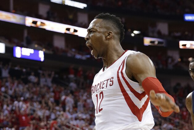 Houston Rockets' Dwight Howard reacts after a dunk during the second half of Game 2 in an NBA basketball first-round playoff series against the Dallas Mavericks, Tuesday, April 21, 2015, in Houston. (AP Photo/David J. Phillip)