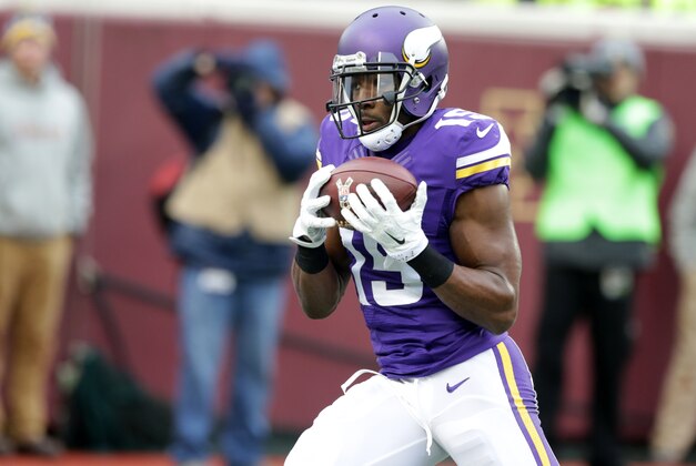 Minnesota Vikings wide receiver Greg Jennings catches a 5-yard touchdown pass during the second half of an NFL football game against the Green Bay Packers, Sunday, Nov. 23, 2014, in Minneapolis. The Packers won 24-21. (AP Photo/Jim Mone)
