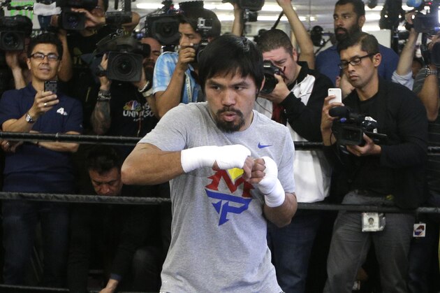 Boxer Manny Pacquiao, of the Philippines, shadow-boxes during a media workout at Wild Card Boxing Club, Wednesday, April 15, 2015, in Los Angeles. Pacquiao is scheduled to fight Floyd Mayweather Jr. in a welterweight boxing match in Las Vegas on May 2. (AP Photo/Jae C. Hong)
