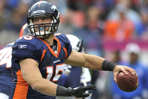 Denver Broncos quarterback Tim Tebow (15) looks to pass against the San Diego Chargers in the third quarter during an NFL football game, Sunday, Oct. 9, 2011, in Denver.  (AP Photo/Jack Dempsey)