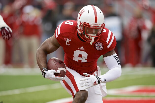 Nebraska running back Ameer Abdullah (8) carries the ball in the first half of an NCAA college football game against Minnesota in Lincoln, Neb., Saturday, Nov. 22, 2014. (AP Photo/Nati Harnik)