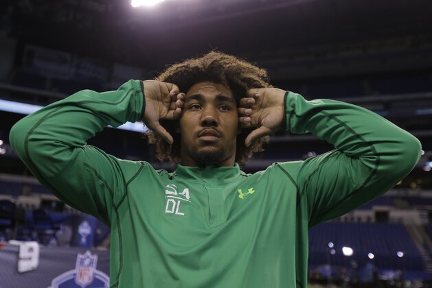 USC defensive lineman Leonard Williams stretches before drills at the NFL football scouting combine in Indianapolis, Sunday, Feb. 22, 2015. (AP Photo/Julio Cortez)