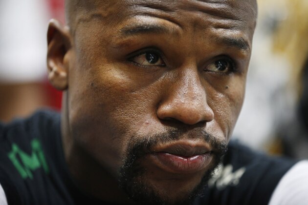 Boxer Floyd Mayweather Jr. gets taped up before a workout Tuesday, April 14, 2015, in Las Vegas. Mayweather will face Manny Pacquiao in a welterweight boxing match in Las Vegas on May 2. (AP Photo/John Locher)