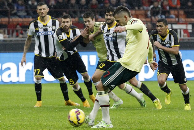 AC Milan's Jeremy Menez, second right, scores on a penalty kick during the Serie A soccer match between AC Milan and Udinese at the San Siro stadium in Milan, Italy, Sunday, Nov. 30, 2014. (AP Photo/Antonio Calanni)