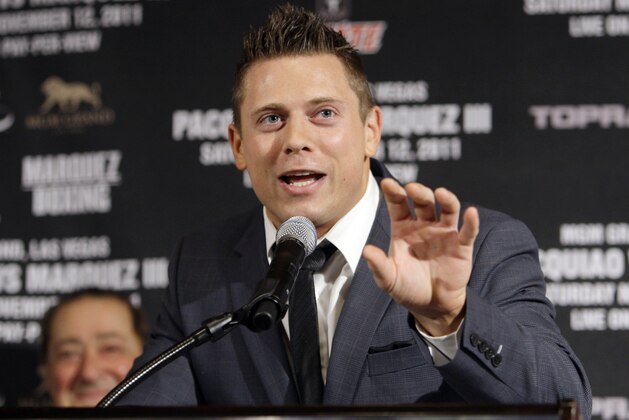 WWE Champion The Miz, center, speaks at a news conference to promote a world welterweight champioship bout between Manny Pacquiao, of the Philippines, and Juan Manuel Marquez, of Mexico, Pacquiao-Marquez III, in Beverly Hills, Calif., Wednesday, Sept. 7, 2011.  The fighters will meet Saturday, Nov. 12, 2011, at the MGM Grand in Las Vegas. (AP Photo/Reed Saxon)