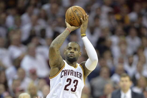 Apr 21, 2015; Cleveland, OH, USA; Cleveland Cavaliers forward LeBron James (23) shoots in the fourth quarter against the Boston Celtics in game two of the first round of the NBA Playoffs at Quicken Loans Arena. Mandatory Credit: David Richard-USA TODAY Sports