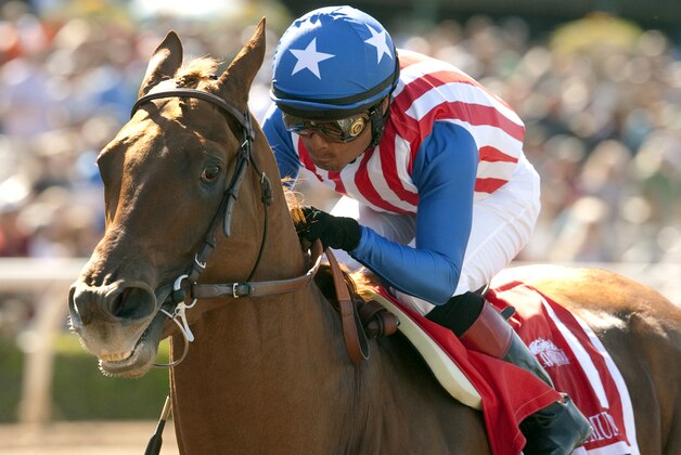 FILE -  In this April 4, 2015, file photo, provided by Benoit Photo, Dortmund, ridden by jockey Martin Garcia, wins the Grade I $1,000,000 Santa Anita Derby horse race, at Santa Anita Park, in Arcadia, Calif. Too close to call? Dortmund, American Pharoah; American Pharoah, Dortmund. Both are worthy Kentucky Derby favorites but only one can finish No. 1 in the AP's final Run for the Rose Top 10 rankings. (Benoit Photo via AP, File)