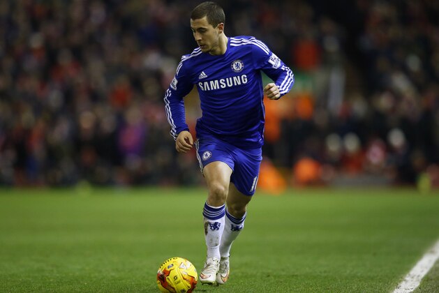 Chelsea's Eden Hazard runs with the ball during the English League Cup semi-final first leg soccer match between Liverpool and Chelsea at Anfield Stadium, Liverpool, England, Tuesday Jan. 20, 2015. (AP Photo/Jon Super)