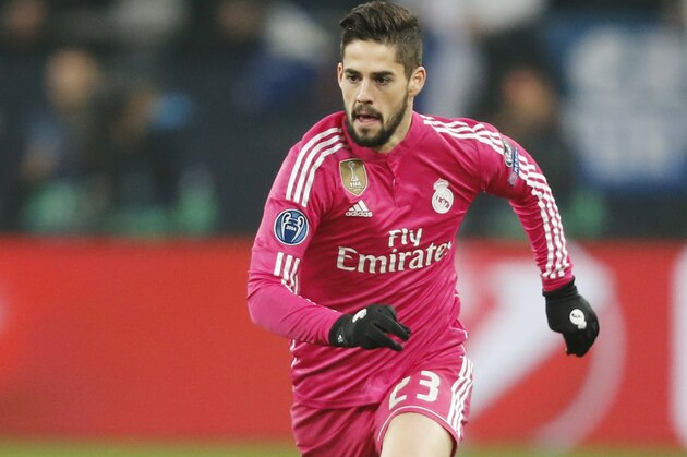 Real Madrid's Isco goes with the ball during the Champions League round of 16 first leg soccer match between FC Schalke 04 and Real Madrid on Wednesday, Feb. 18, 2015 in Gelsenkirchen, Germany. (AP Photo/Frank Augstein)