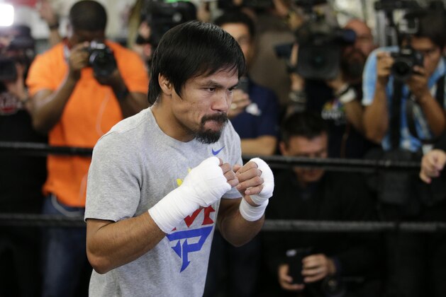 Boxer Manny Pacquiao, of the Philippines, shadow-boxes during a media workout at Wild Card Boxing Club, Wednesday, April 15, 2015, in Los Angeles. Pacquiao is scheduled to fight Floyd Mayweather Jr. in a welterweight boxing match in Las Vegas on May 2. (AP Photo/Jae C. Hong)