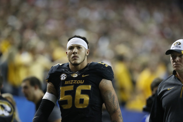 Missouri defensive lineman Shane Ray (56) walks off the field after being ejected from the game for a late hit against Alabama quarterback Blake Sims during the first half of the Southeastern Conference championship NCAA college football game, Saturday, Dec. 6, 2014, in Atlanta. (AP Photo/Brynn Anderson)