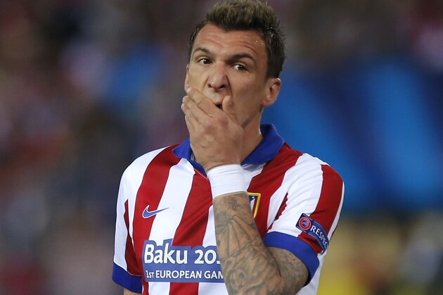 Atletico's Mario Mandzukic reacts during the Champions League quarterfinal first leg soccer match between Atletico Madrid and Real Madrid at the Vicente Calderon stadium in Madrid, Spain, Tuesday, April 14, 2015. (AP Photo/Andres Kudacki) Atletico's Mario Mandzukic reacts during the Champions League quarterfinal first leg soccer match between Atletico Madrid and Real Madrid at the Vicente Calderon stadium in Madrid, Spain, Tuesday, April 14, 2015. (AP Photo/Andres Kudacki)