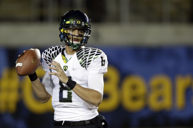 Oregon quarterback Marcus Mariota warms up before an NCAA college football game against California in Berkeley, Calif., Saturday, Nov. 10, 2012. (AP Photo/Marcio Jose Sanchez)