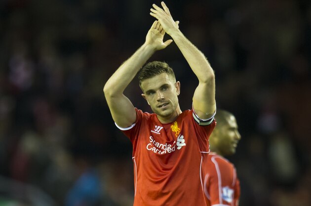 Liverpool's Jordan Henderson applauds supporters after his team's 2-0 win during the English Premier League soccer match between Liverpool and Newcastle at Anfield Stadium, Liverpool, England, Monday, April 13, 2015. (AP Photo/Jon Super)