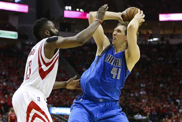 Apr 18, 2015; Houston, TX, USA; Dallas Mavericks forward Dirk Nowitzki (41) controls the ball as Houston Rockets guard James Harden (13) defends during the fourth quarter in game one of the first round of the NBA Playoffs at Toyota Center. The Rockets defeated the Mavericks 118-108. Mandatory Credit: Troy Taormina-USA TODAY Sports