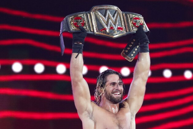 IMAGE DISTRIBUTED FOR WWE - WWE Superstar Seth Rollins celebrates becoming the new WWE World Heavyweight Champion at WrestleMania 31 at Levi's Stadium on Sunday, March 29, 2015 in Santa Clara, CA. WrestleMania broke the Levi’s Stadium attendance record at 76,976 fans from all 50 states and 40 countries. (Don Feria/AP Images for WWE)
