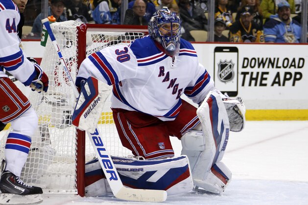 New York Rangers goalie Henrik Lundqvist (30) plays during a timeout during the second inning of a first-round NHL playoff hockey game against the Pittsburgh Penguins in Pittsburgh Wednesday, April 22, 2015.(AP Photo/Gene J. Puskar)