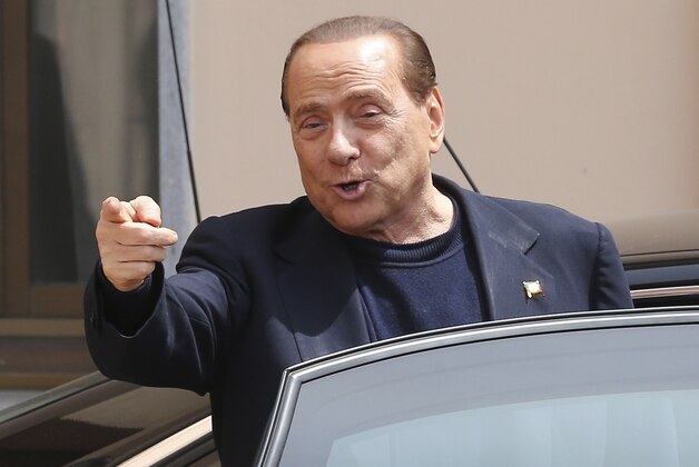 FILE - In this Friday, May 9, 2014 file photo, Silvio Berlusconi smiles as he leaves the