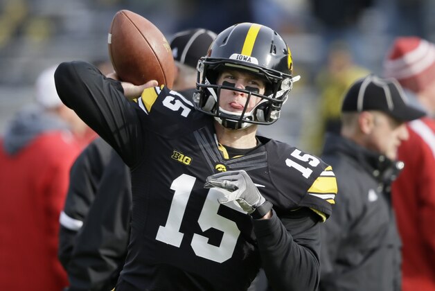 FILE - In this Nov. 28, 2014, file photo, Iowa quarterback Jake Rudock warms up before an NCAA college football game against Nebraska in Iowa City, Iowa. Iowa coach Kirk Ferentz is expected to clarify that status of quarterback Jake Rudock, a two-year starter relegated to the bench for spring ball. (AP Photo/Charlie Neibergall, File)