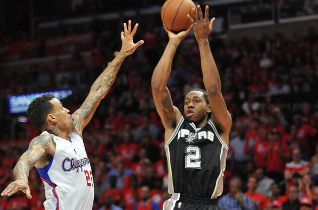 April 22, 2015; Los Angeles, CA, USA; San Antonio Spurs forward Kawhi Leonard (2) shoots against the defense of Los Angeles Clippers forward Matt Barnes (22) during the second half in game two of the first round of the NBA Playoffs. at Staples Center. Mandatory Credit: Gary A. Vasquez-USA TODAY Sports