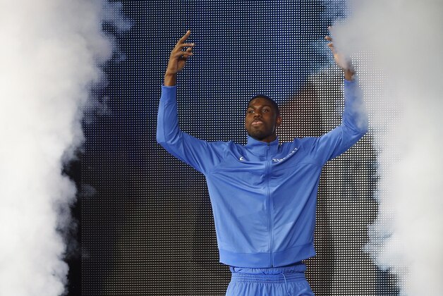 Kentucky's Alex Pothress is introduced during the team's NCAA college basketball Big Blue Madness, Friday, Oct. 17, 2014, in Lexington, Ky. (AP Photo/James Crisp)