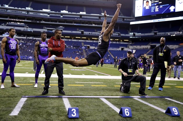 Wake Forest defensive back Kevin Johnson runs a drill at the NFL football scouting combine in Indianapolis, Monday, Feb. 23, 2015. (AP Photo/Julio Cortez)
