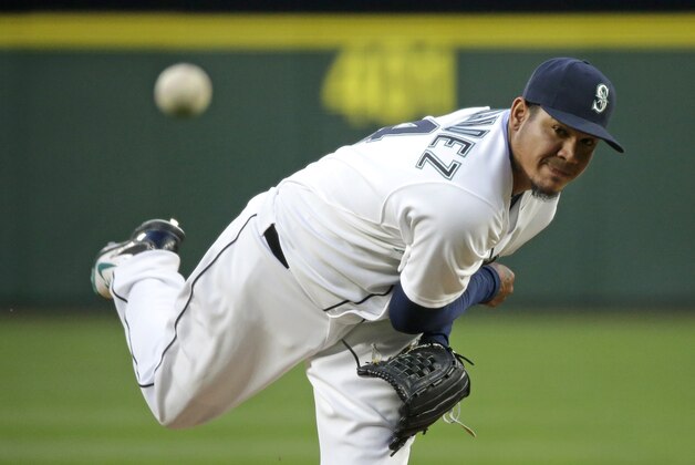 Seattle Mariners starting pitcher Felix Hernandez throws against the Texas Rangers during a baseball game, Saturday, April 18, 2015, in Seattle. (AP Photo/Ted S. Warren)